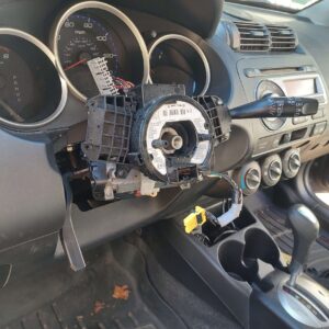 Interior of a car with the steering wheel removed